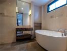 Modern bathroom with a free-standing bathtub and a glass-enclosed shower