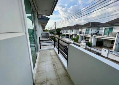 Spacious balcony with a view of a residential neighborhood