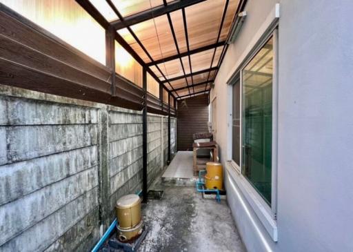 Narrow covered side passage of a residential building