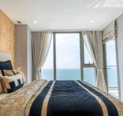 Modern bedroom with sea view and balcony access