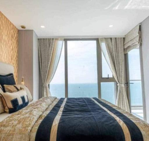 Modern bedroom with sea view and balcony access