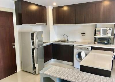 Modern kitchen with appliances and wooden cabinets