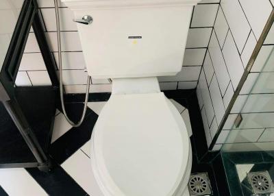 Modern bathroom interior with black and white checkered floor