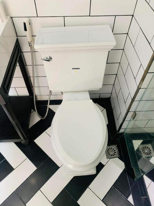 Modern bathroom interior with black and white checkered floor