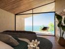 Modern bedroom with panoramic ocean view and natural wood accents