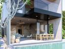 Modern two-story house with exterior dining area and pool