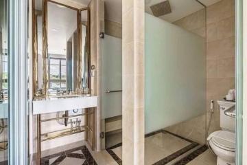 Modern bathroom with glass shower and dual vanity