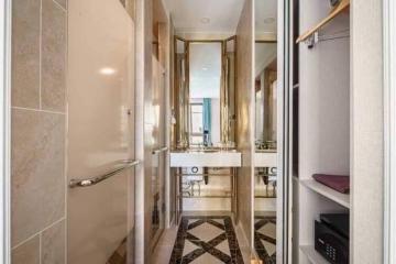 Elegant bathroom with walk-in shower and mirrored vanity