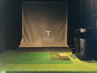 Customized entertainment room with golf simulation setup and modern décor