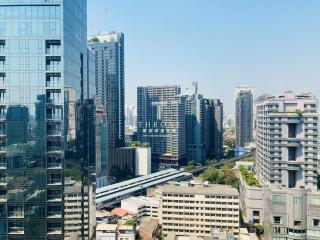 High-rise urban landscape with buildings and a metro system