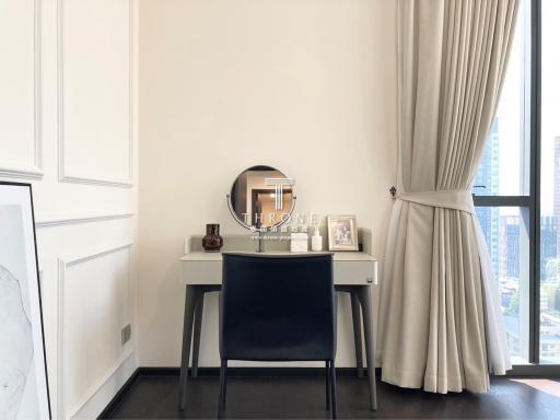 Elegant bedroom with modern desk setup and floor to ceiling window