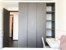 Modern bedroom with built-in wardrobe and open shelving