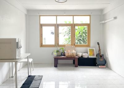 Bright living room with large windows and minimalistic decor