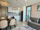 Modern furnished apartment interior with open plan living, kitchen and dining area