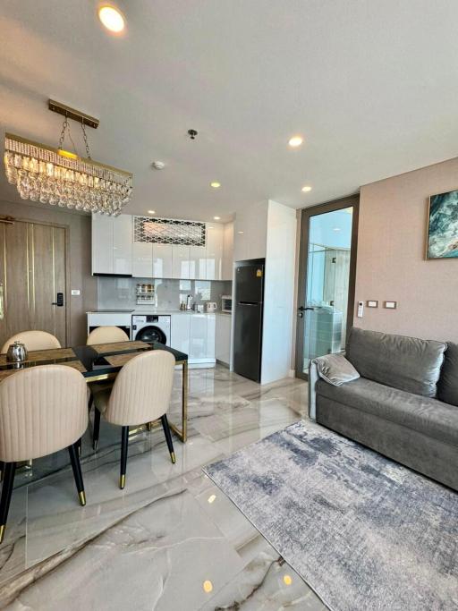 Modern furnished apartment interior with open plan living, kitchen and dining area