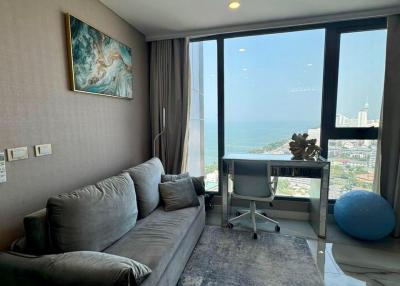 Modern living room with ocean view and ample natural light