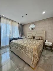 Elegant bedroom with king-sized bed and glossy floor