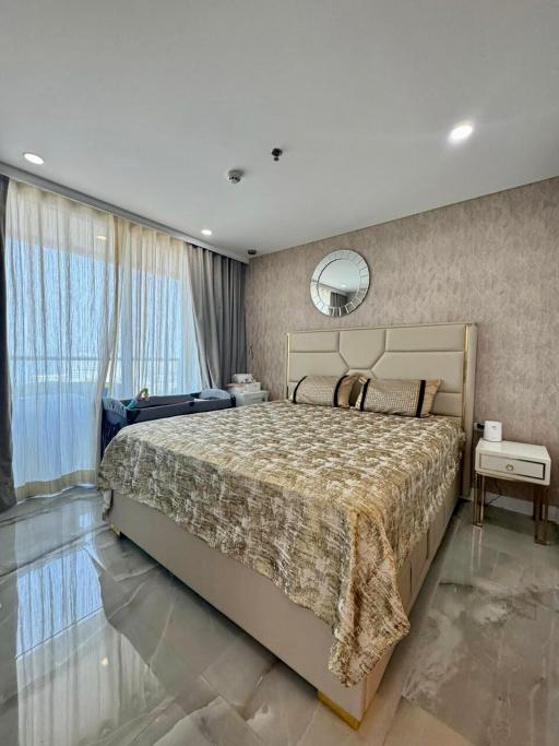 Elegant bedroom with king-sized bed and glossy floor