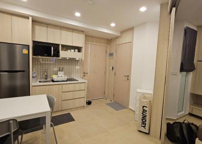 Modern compact kitchen with integrated laundry area