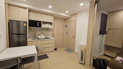 Modern compact kitchen with integrated laundry area