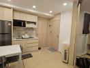 Modern compact kitchen with integrated laundry area