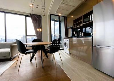 Modern apartment interior with open plan living space, dining area, and kitchen