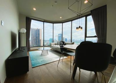 Modern living room with floor-to-ceiling windows and city view