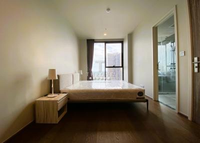 Modern bedroom with city view and en suite bathroom