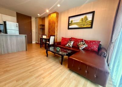 Cozy living room with modern furnishings and hardwood flooring