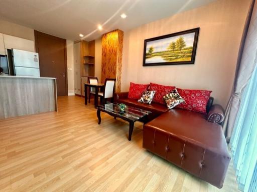 Cozy living room with modern furnishings and hardwood flooring