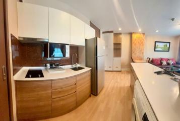 Modern kitchen with stainless steel appliances and wooden cabinetry