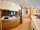 Modern kitchen with stainless steel appliances and wooden cabinetry