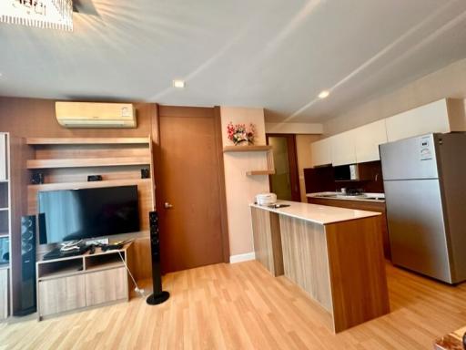 Modern kitchen with wooden cabinets and integrated appliances