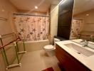 Modern bathroom interior with a large mirror and nautical-themed shower curtain