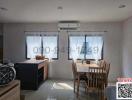 Modern kitchen with dining area and ample sunlight