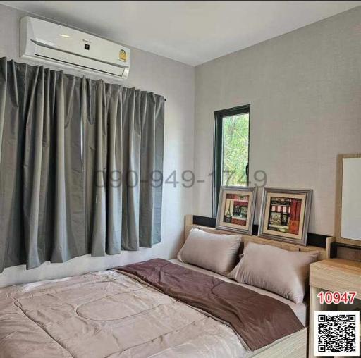 Cozy bedroom with modern decor and air conditioning