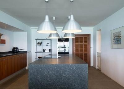 Modern kitchen with central island and pendant lighting