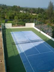 Tennis court surrounded by nature