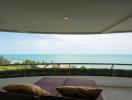 Spacious balcony with ocean view and comfortable seating