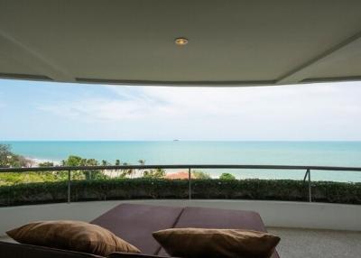 Spacious balcony with ocean view and comfortable seating