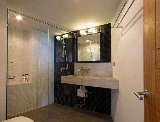 Modern bathroom with shower and stylish sink