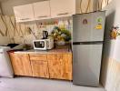 Modern kitchen with wooden cabinets and stainless steel appliances