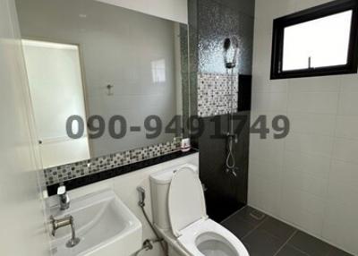 Modern bathroom with clean design and tiled walls