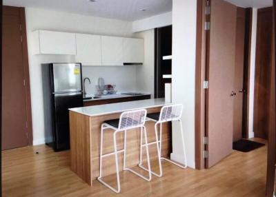 Modern kitchen with breakfast bar and stainless steel appliances