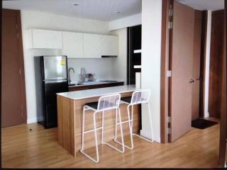 Modern kitchen with breakfast bar and stainless steel appliances