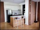 Modern kitchen with breakfast bar and stainless steel appliances