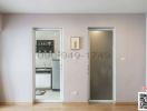 Hallway with view into kitchen and adjacent room