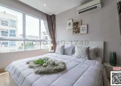 Modern bedroom with natural light and cozy decor