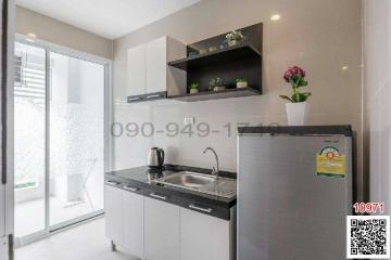 Modern kitchen with stainless steel appliances and open shelving