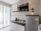 Modern kitchen with stainless steel appliances and open shelving